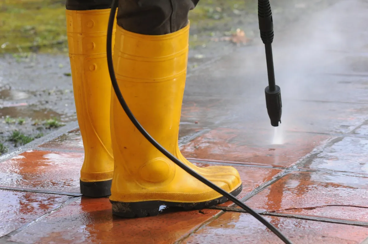 Plumbing professional working around a wet surface